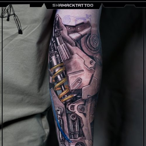 biomechanical-forearm-yellow-spring-2-mechanical-Shamack-tattoo