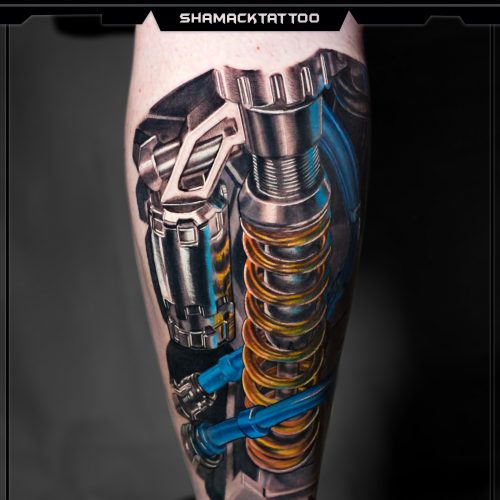 biomechanical-leg-spring-yellow-2-left-mechanical-Shamack-inkden-tattoo