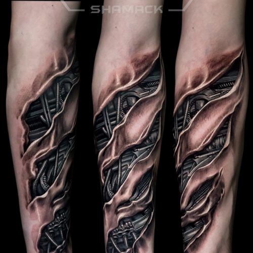 h-r-giger-3d-riped-skin-realism-forearm-Black-and-grey-tattoo-Shamack-Inkden