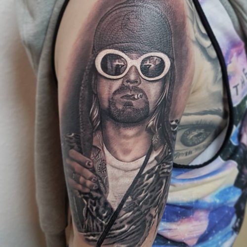 portrait-tattoo-of-Kurt-cobain-in-white-glasses-Pedro-VanDiesel-Tattoo_Inkden-Tattoo-Studio_Blackpool